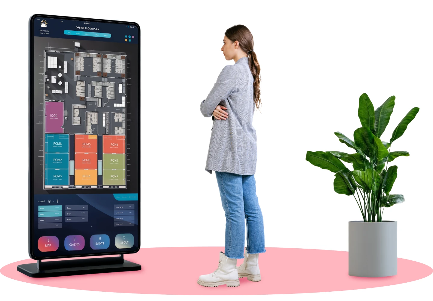 A young woman in a casual outfit, including a gray sweater, jeans, and white boots, stands with her arms crossed while looking at a large vertical digital signage display. The screen shows a detailed office floor plan with color-coded sections and interactive navigation buttons. A potted green plant is placed nearby, and the scene is set against a clean, minimalist background with a pink circular accent on the floor.